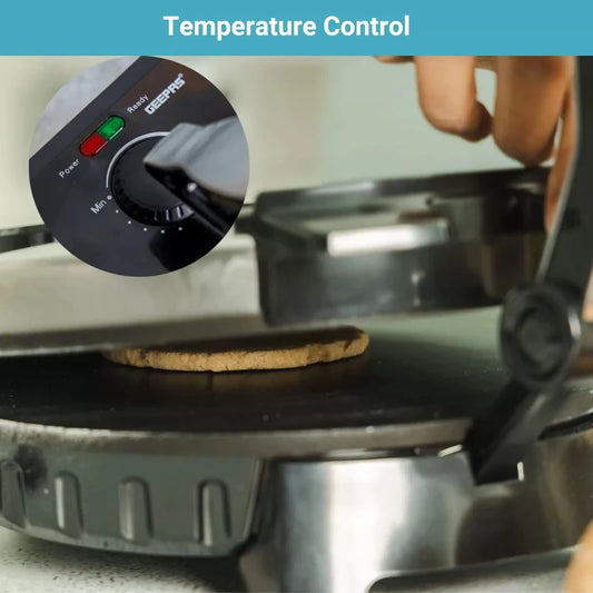 Close-up of a camping stove with a cookie on top, featuring temperature control knob.